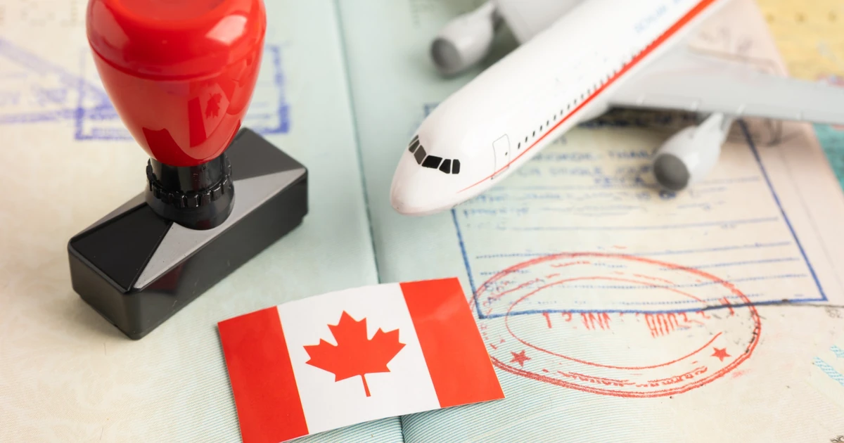 Canadian visa application documents, passport and currency representing common Canada visitor visa refusal reasons
